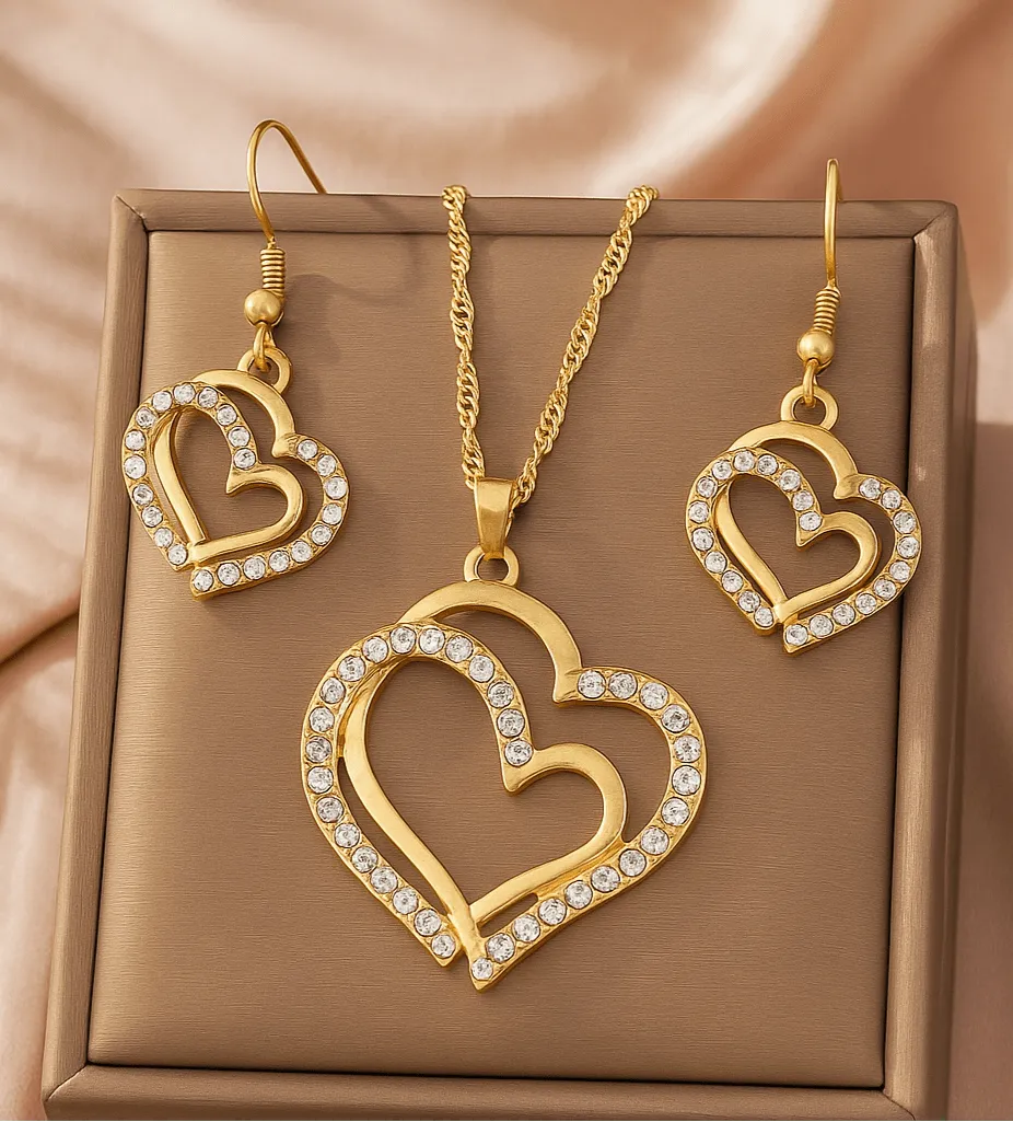 Gold heart-shaped necklace and earrings on a person - Double Heart Pendant Jewelry Set – Necklace & Earrings for Women - miraye.net