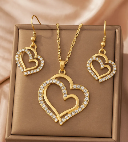 Gold heart-shaped necklace and earrings on a person - Double Heart Pendant Jewelry Set – Necklace & Earrings for Women - miraye.net