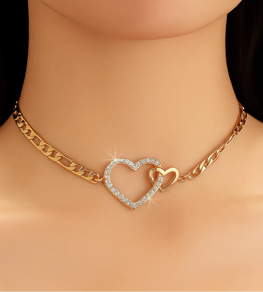 Gold necklace with a heart-shaped pendant on a mannequin